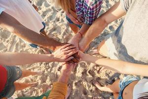 Happy friends at the beach photo