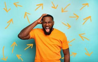 Man with stressed and exhausted expression is confused photo