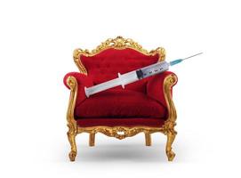 Luxury armchair with a syringe with the vaccine of covid-19 photo