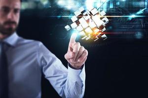 Innovation in the digital world. Businessman pointing at abstract cubes shines. 3D Rendering photo