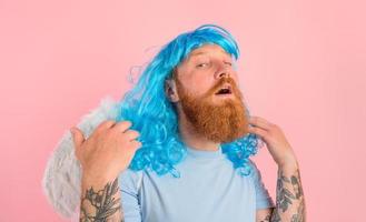 man with beard and blue peruke acts like an agel with wings photo