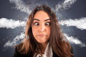 Businesswoman with head ready to explode due to stress and overwork photo