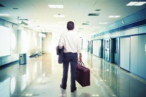 Businessman in airport ready to travel photo