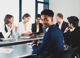 Team of businessmen work together in office. Concept of teamwork and partnership photo