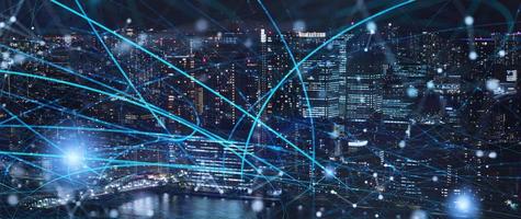 Fast connection in the city at night. Concept of social network and internet network photo