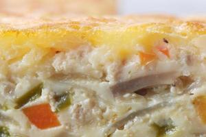 Homemade puff pastry with chicken and vegetables photo