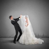 Amazed husband lifts the veil of wife photo