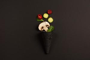 Modern composition concept with vegetable on dark background photo