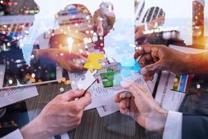 Teamwork of partners. Concept of integration and startup with puzzle pieces photo