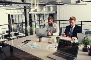 Business people that work together in office at the night. Concept of teamwork and partnership. double exposure photo