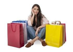 Happy woman with bags after shopping. Isolated on white background. photo