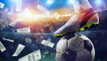 Soccer player in stadium with falling banknotes of bettors photo