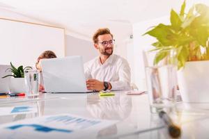 Business people in office work together during a meeting photo