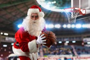 Santa claus ready to play basketball for Christmas photo