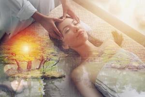 Woman relaxing with a massage in a spa center photo