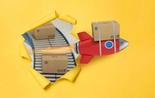 Carton box flies fast with rocket. concept of express and priority delivery photo