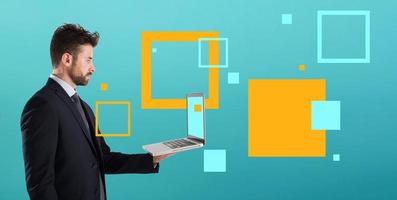 Businessman works with his laptop and shared data via internet. Isolated on white background photo