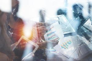 Team of business person works together. Concept of teamwork. Double exposure with internet connection network effects. photo