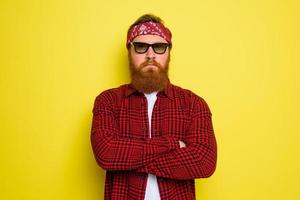 Serious man with beard and bandana in head photo