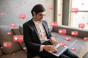 Businessman at home works with social networks photo