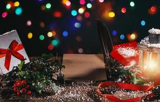 Desk with presents and a blank letter to santa claus photo