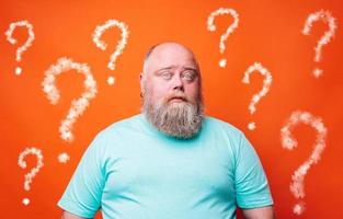 Confused man thinks something and has a lot of questions photo