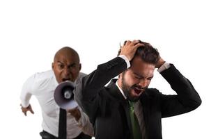 Boss scolds with megaphone a desperate employee with a verbal aggression photo