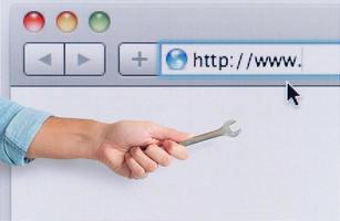 Hand with wrench over a internet web browser. concept of fix errors photo