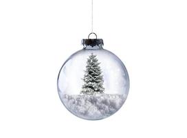 Xmas glass ball with christmas tree full of snow photo