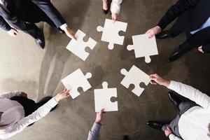 Teamwork of partners. Concept of integration and startup with puzzle pieces photo