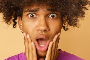 Man with curly hair is amazed about something photo