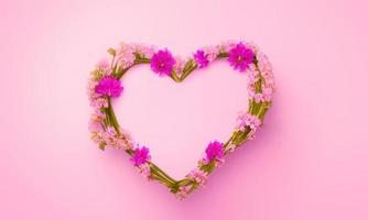 pink heart with pink flowers on pink background photo