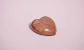 heart shape stone on plain background for valentines day photo