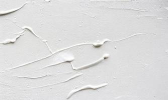 white painted wall texture background, thick brush strokes photo