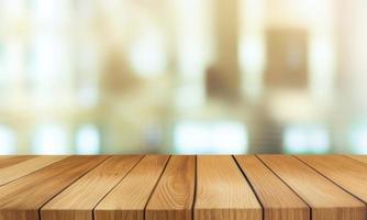 wooden table top on blurred background of half curtained window photo