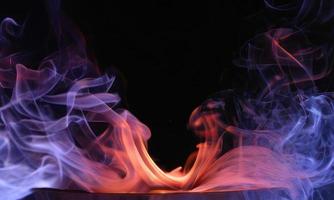 colorful smoke on black background photo