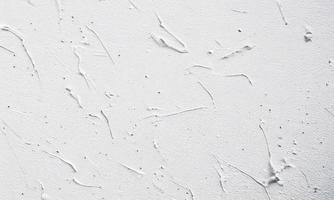 white painted wall texture background, thick brush strokes photo