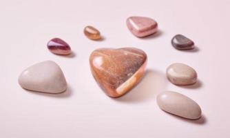 heart shape stone on plain background for valentines day photo