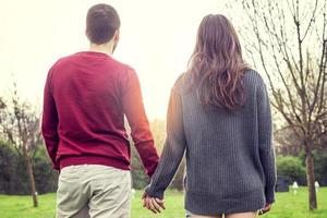nice couple boyfriends relaxes walking hand in hand photo