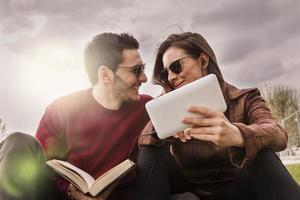 nice couple boyfriends relaxing sitting on meadow photo