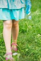 Little girl with crumpled plastic bottle photo