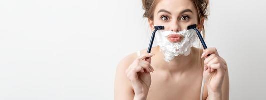 Woman with shaving foam on her face photo