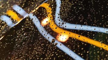 Droplets with reflection of beauty led light at rain repel car body video