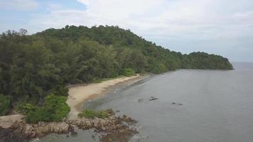 Aerial establishing beach at Sungai Batu surrounded by green forest video