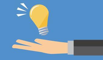 Man's hand holding a light bulb. vector