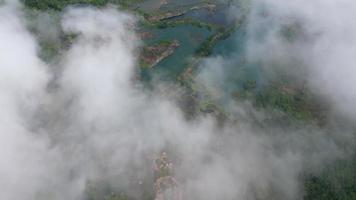 Aerial view white cloud fly through quarry video