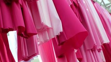 Select focus the pink fabric clothes hanging video