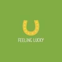 Minimalistic st patricks day card with horseshoe and feeling lucky text. vector