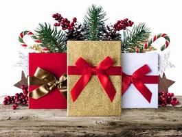 Xmas grunge decoration background with presents on wooden boards photo