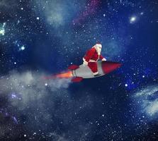 Fast delivery of Christmas gifts with Santa Claus in the space photo